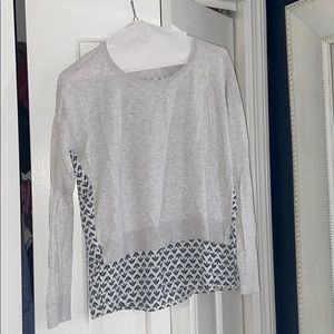 Gray and patterned sweater and silk top